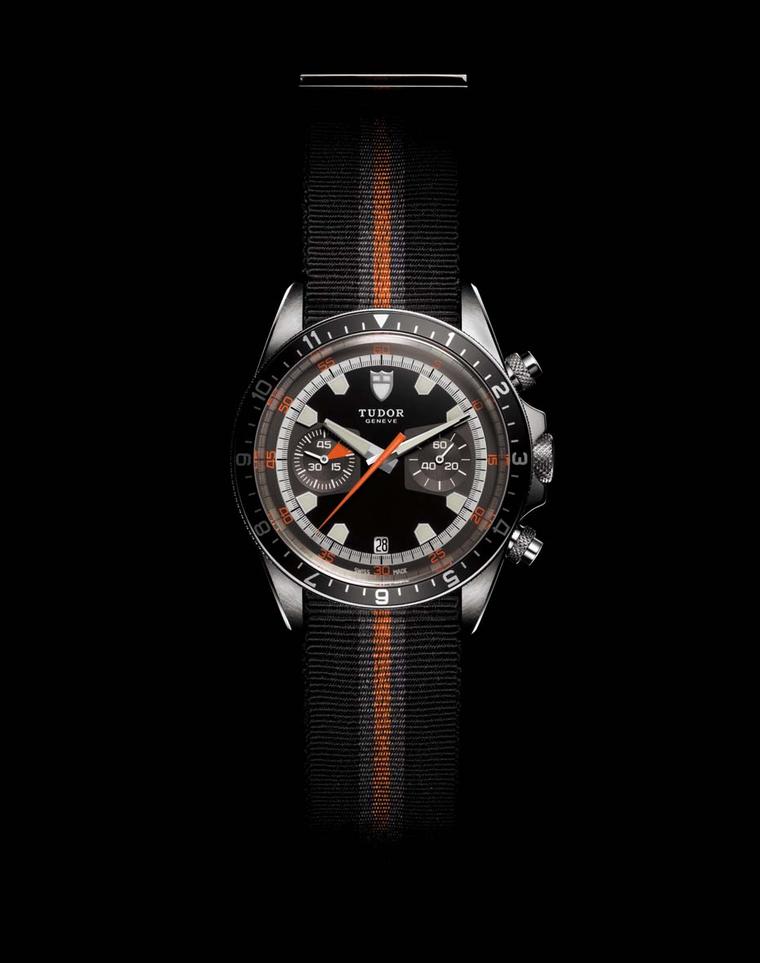 Reflecting the design of the original 1970s Chrono, the retro Tudor Heritage Chrono watch features a mechanical alarm as well as a black, grey and orange fabric strap, with a seat belt-inspired buckle.