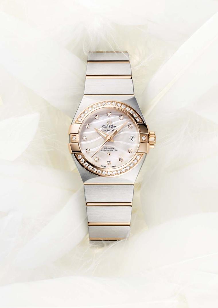 The 27mm Omega Constellation Pluma watch features a mother-of-pearl dial and diamond indices.