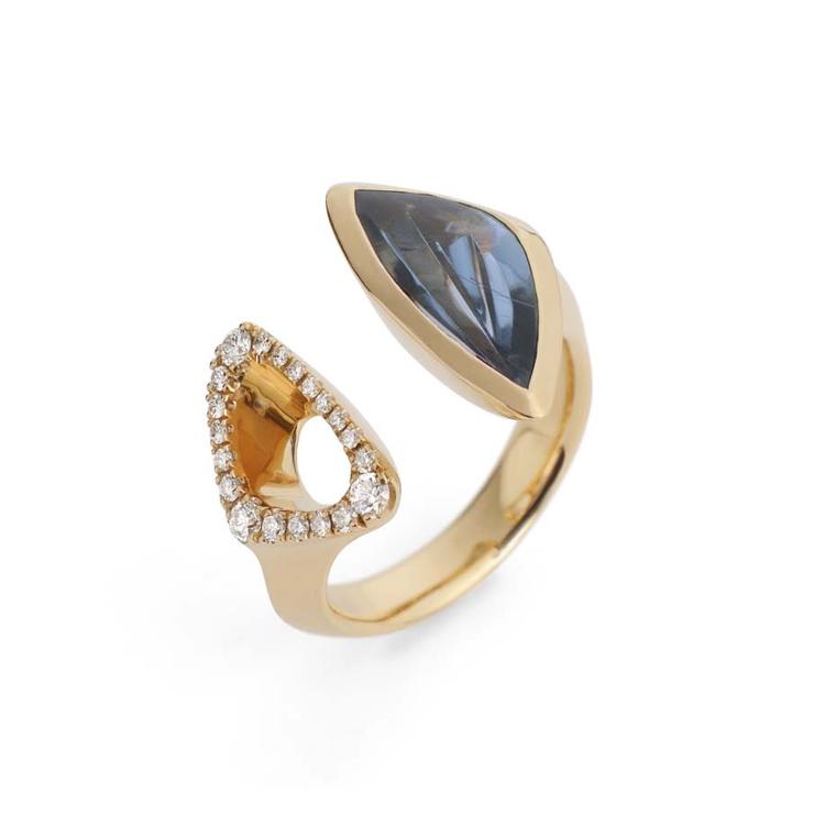 McCaul Goldsmiths Carve ring with an indicolite juxtaposed by a gold diamond-set frame.