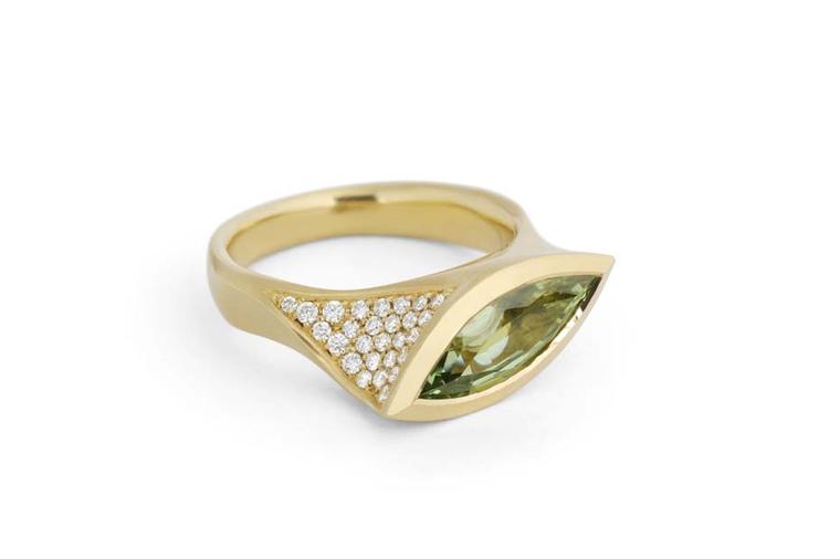 McCaul Goldsmiths Carve collection ring with a mint green garnet surrounded by diamonds.