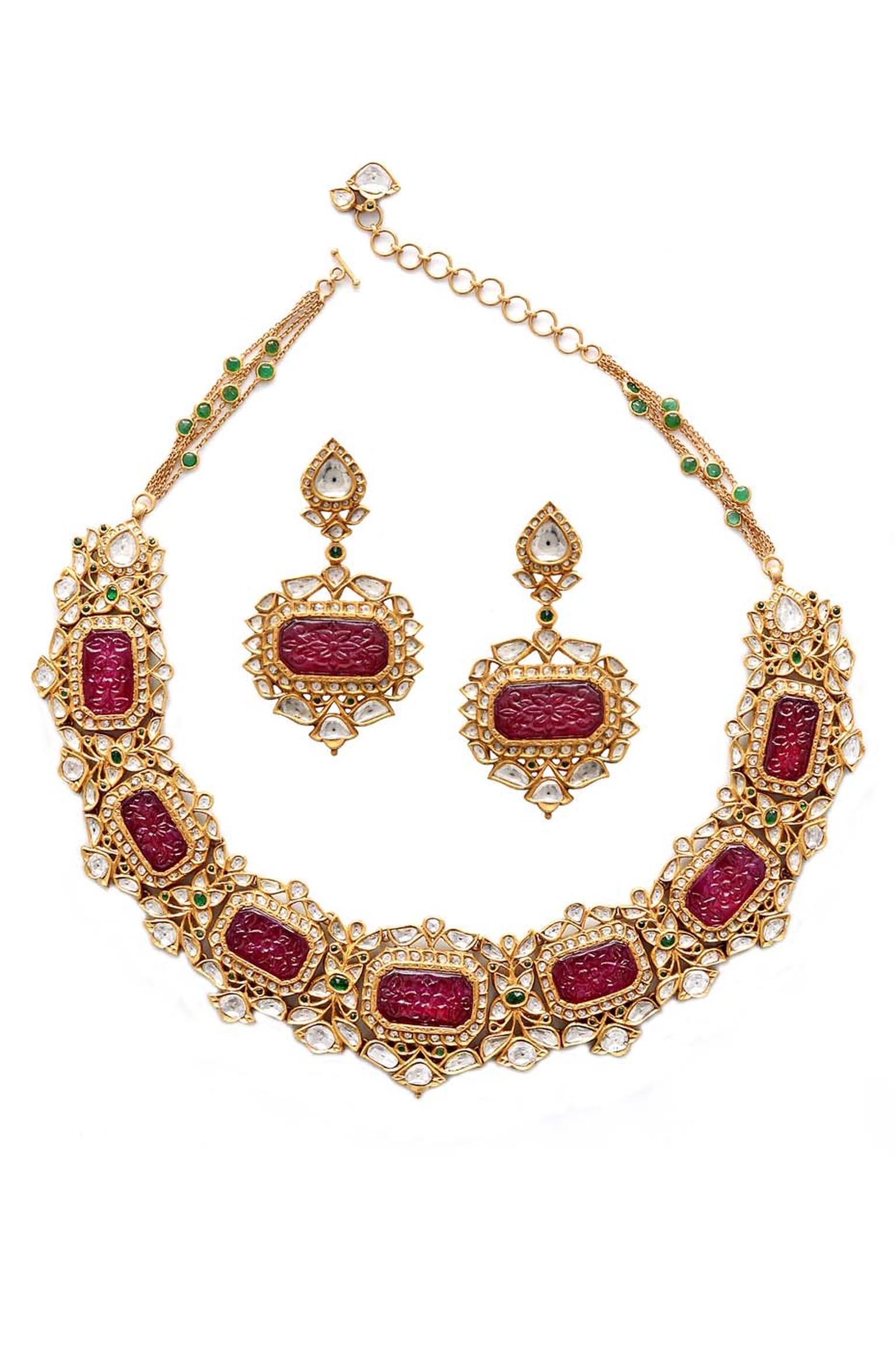 Amrapali gold necklace and earrings set with carved rubies and diamonds.