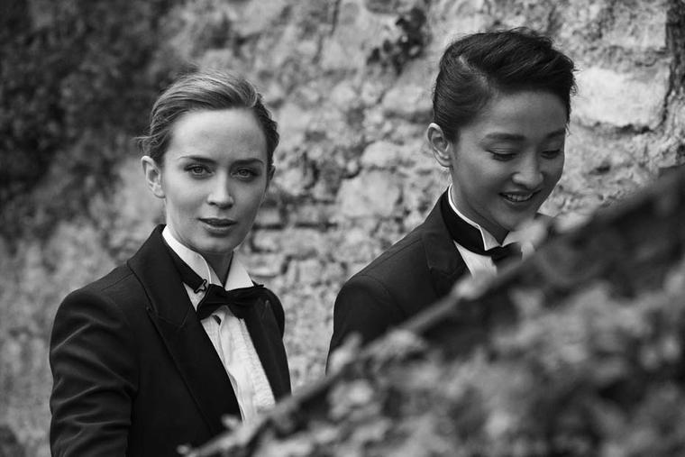 Renowned photographer Peter Lindbergh captures a candid moment with Emily Blunt and Zhou Xun.