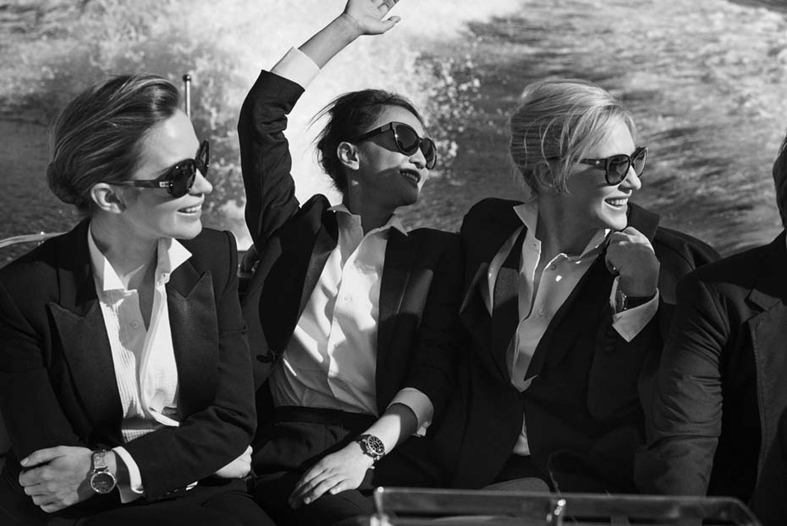 IWC's "Timeless Portofino" photo shoot features actresses Cate Blanchett, Emily Blunt and Zhou Xun, exuding grace and sophistication with chignons and black tuxedo blazers on board a Riva speedboat.