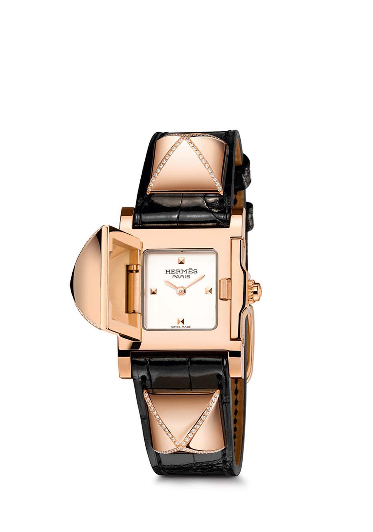 Hermès Médor watch with three partially set diamond pavé pyramids above a smooth ember alligator strap.