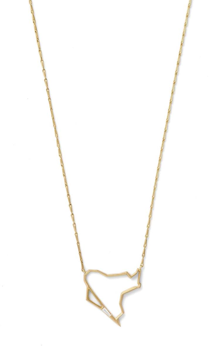 Monique Péan Seto geometric pendant in gold, set with a delicate white diamond baguette.