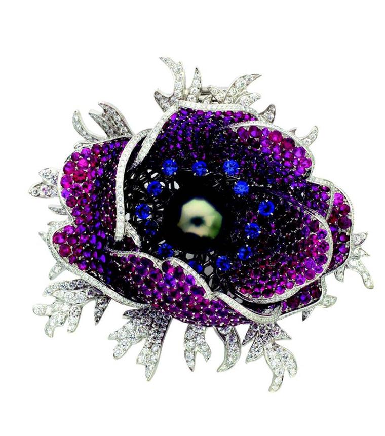 Van Cleef & Arpels 2008 Garance Poppy clip set with rubies, blue sapphires and a grey cultured pearl © Van Cleef & Arpels.