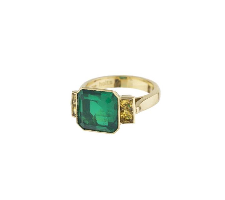 Holts London Strand ring in yellow gold featuring an emerald doublet with yellow sapphire-set shoulders (£2,850).