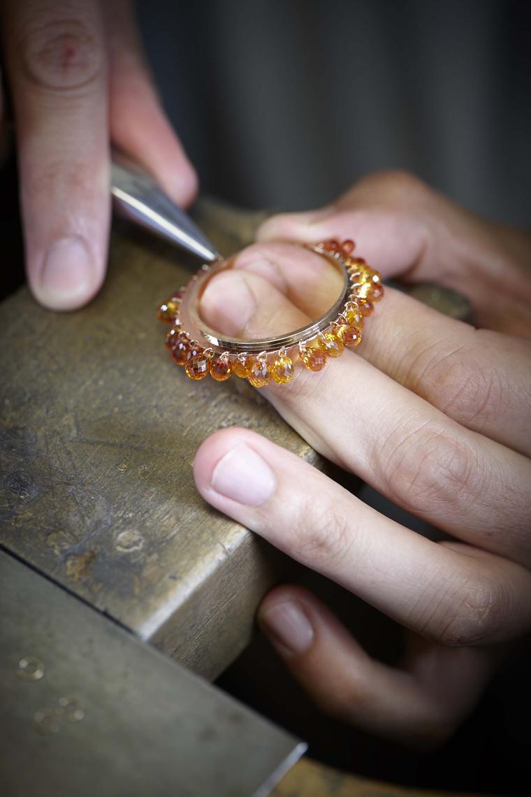The briolette-cut sapphires are attached to the outer bezel so that they move freely and play with the light. Once all the sapphires have been set, the watch is mounted and dismounted several times to ensure the gems move with ease and perfectly complemen