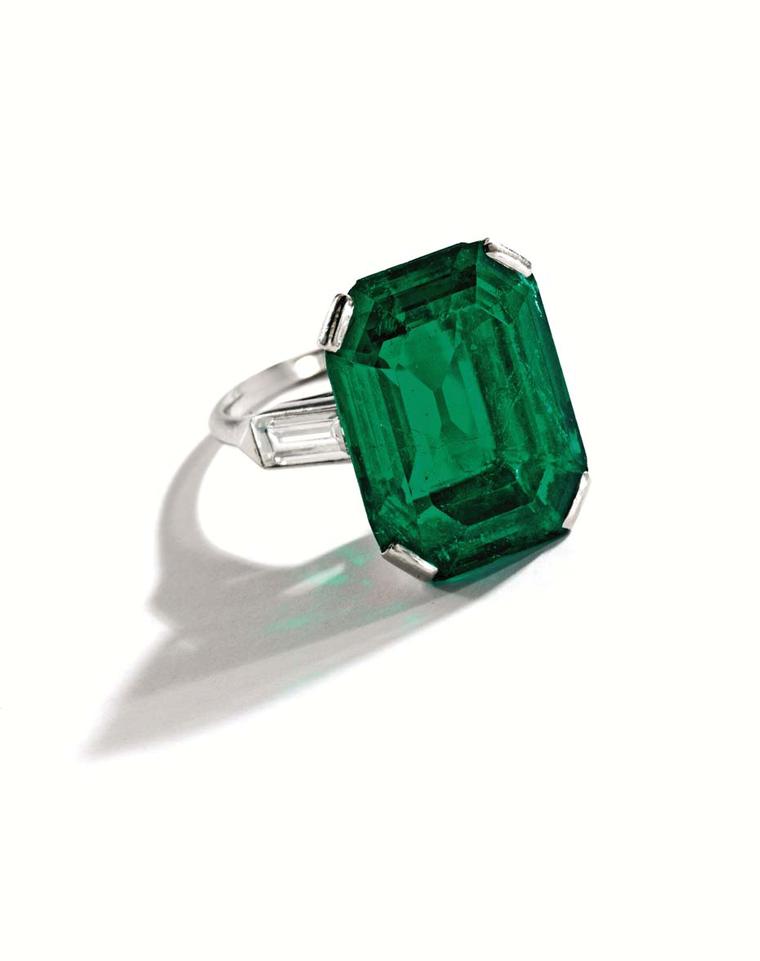 An emerald and diamond ring.