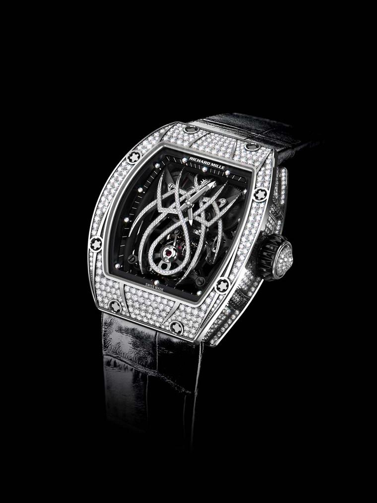 Designed in collaboration with Natalie Portman, the tourbillon movement in the Richard Mille RM 19-01 watch features a diamond-set spider that spreads his tapered legs across the dial while his abdomen holds the tourbillon cage.