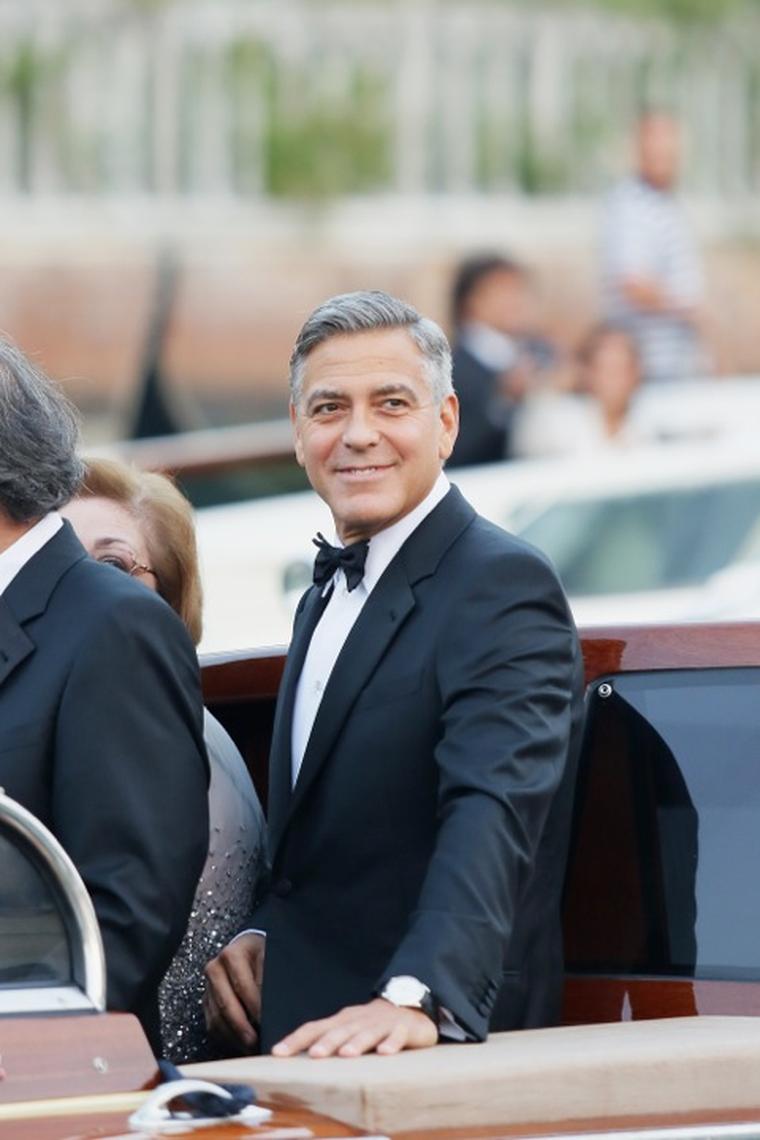 George Clooney looks every inch a man in love as he makes his way by speed boat to his Venice wedding while wearing the The Omega De Ville Trésor watch in white gold.
