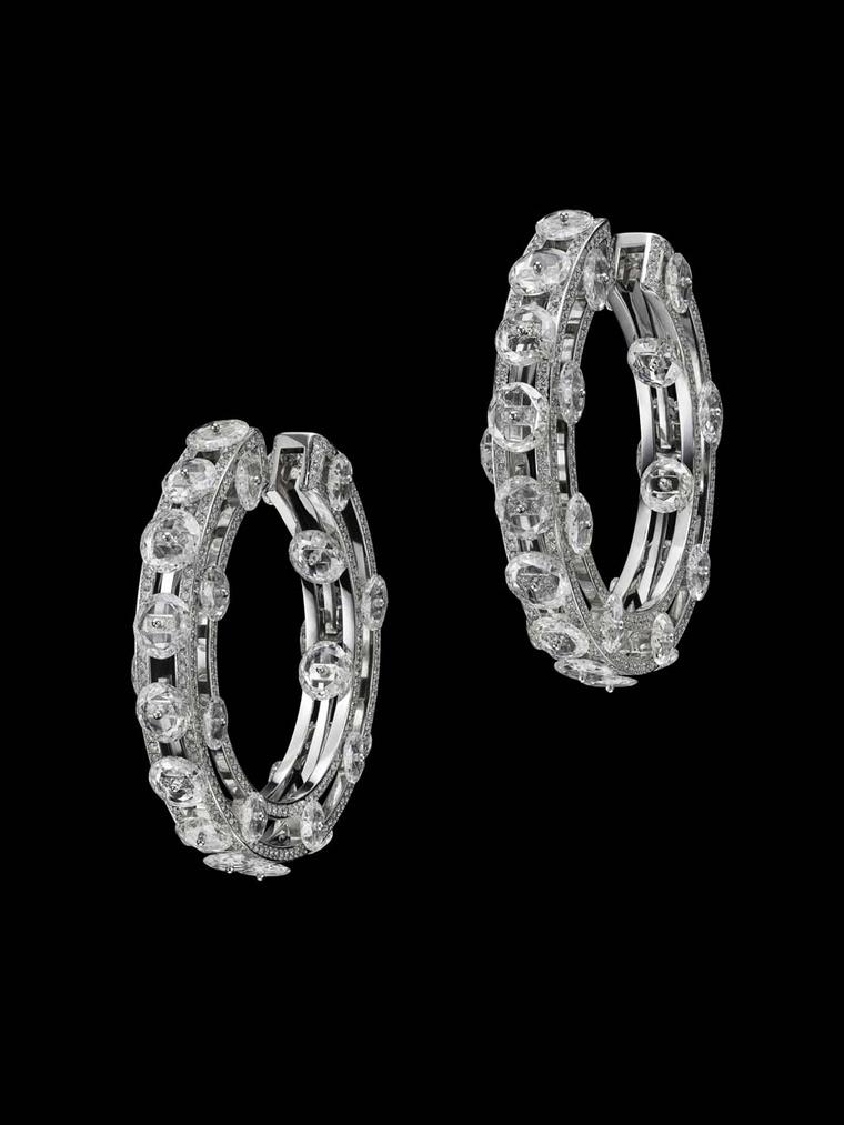 Suzanne Syz Wheel of Brilliance earrings in white gold set with 58 slice diamonds and 1,128 diamonds.