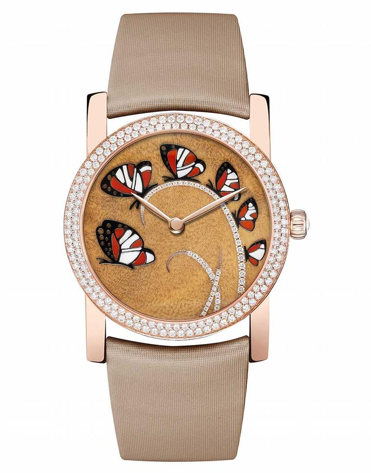 Chaumet Attrape-moi...si tu m'aimes (Catch me...if you love me) watch in pink gold, with a dial decorated with six butterflies set against a precious myrtle burl wood background. The butterfly wings are made from inlaid red carnelian, white wood and black