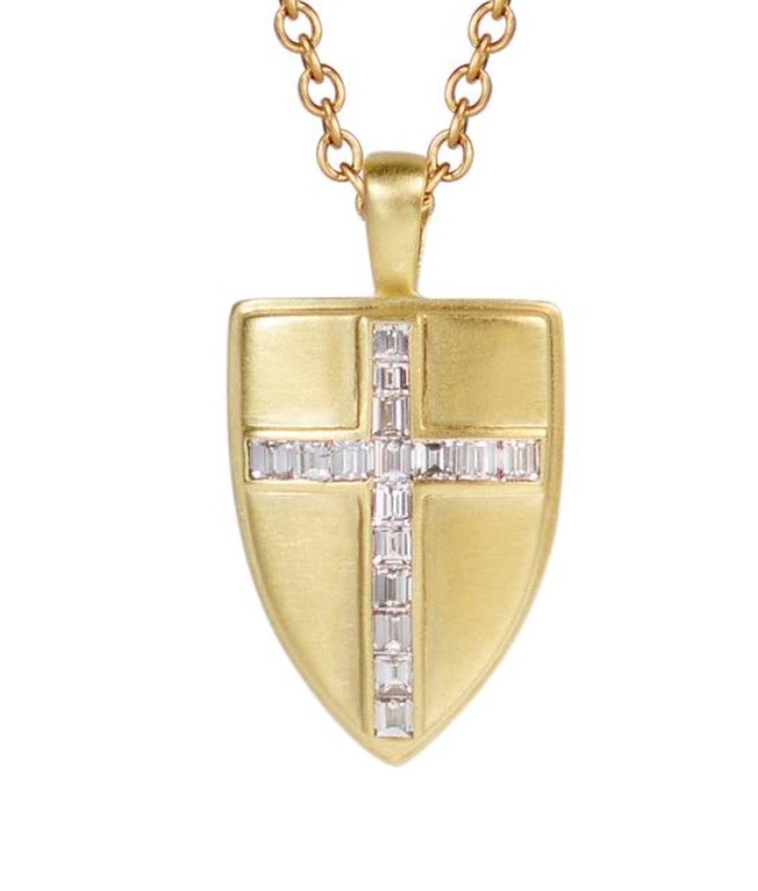 Me & Ro gold shield pendant with diamonds, available to buy with the Spring app.
