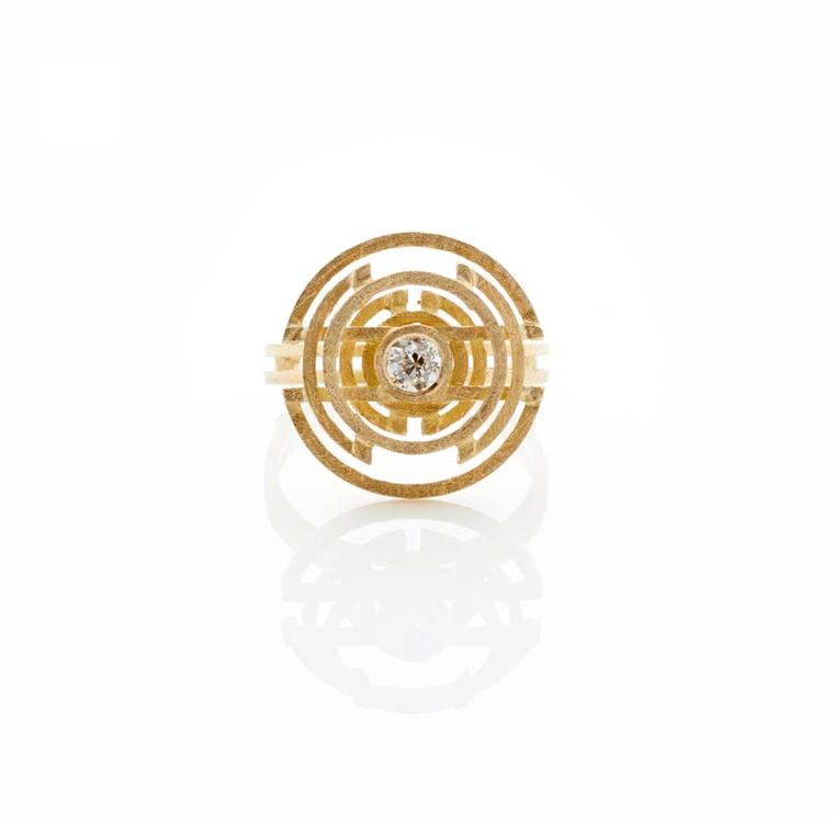 Shimell and Madden's Symmetry collection Large Circle ring.The multi-layered circles have an almost hypnotic effect, drawing the eye to the central Edwardian-cut diamond.