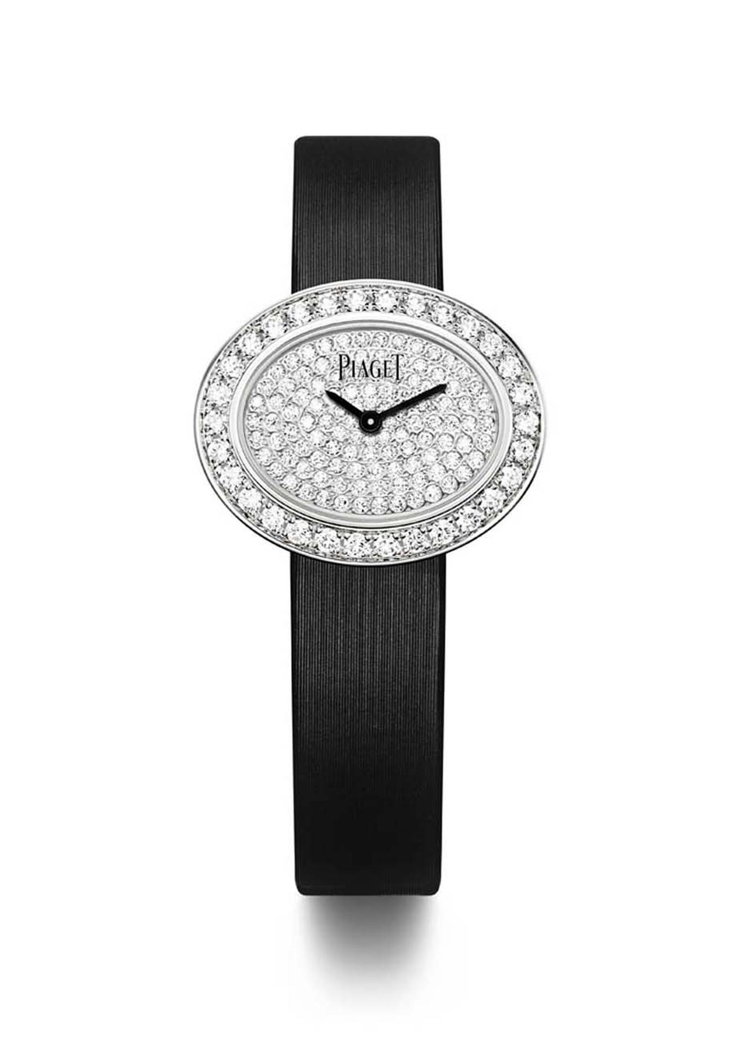 Piaget Limelight Diamonds watch in white gold with an oval-shaped case and black lacquer dial, set with 1.00ct diamonds on the bezel and a further 0.60ct on the dial, presented on a black satin strap with an ardillon buckle set with a single diamond.