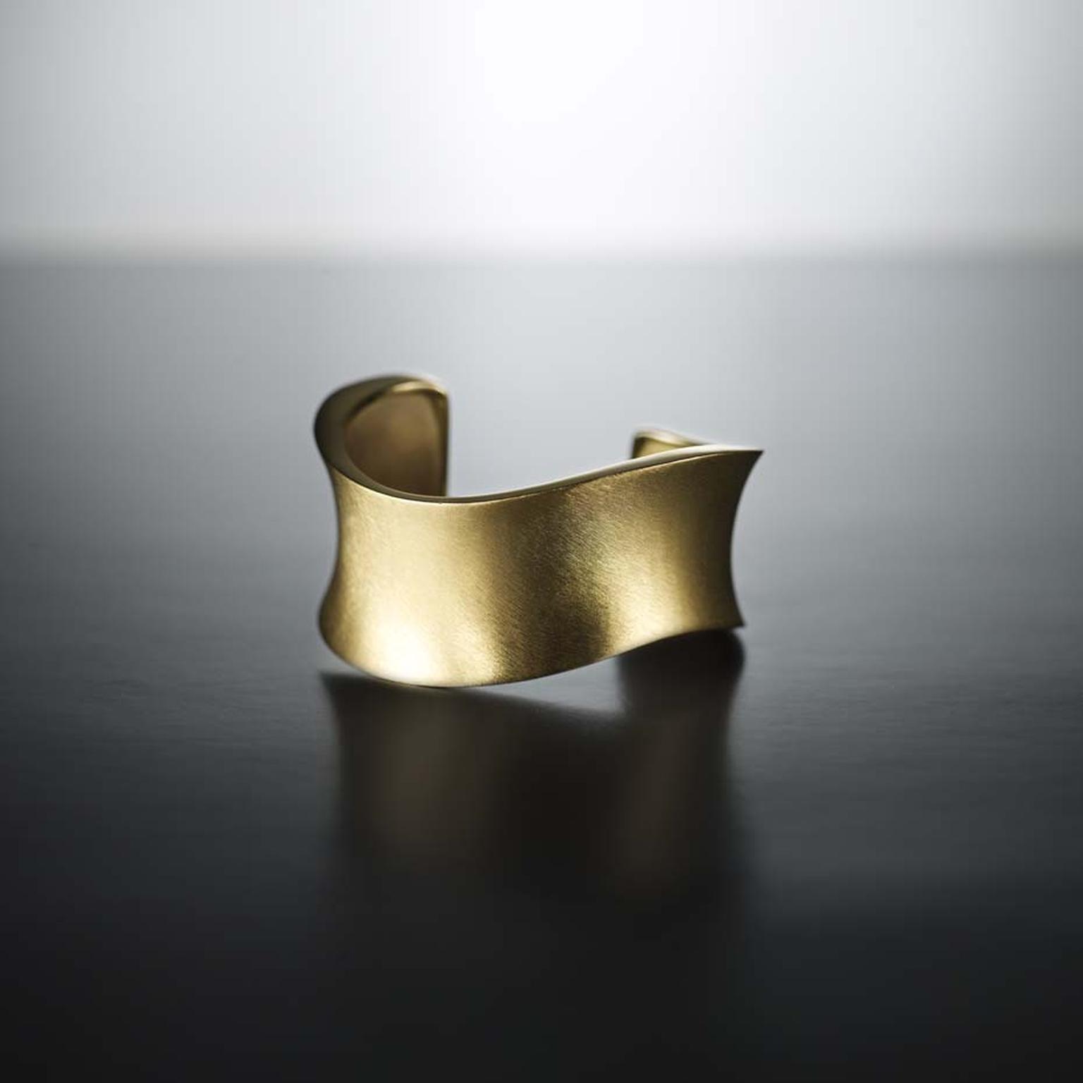 Walid Akkad gold textured bracelet.