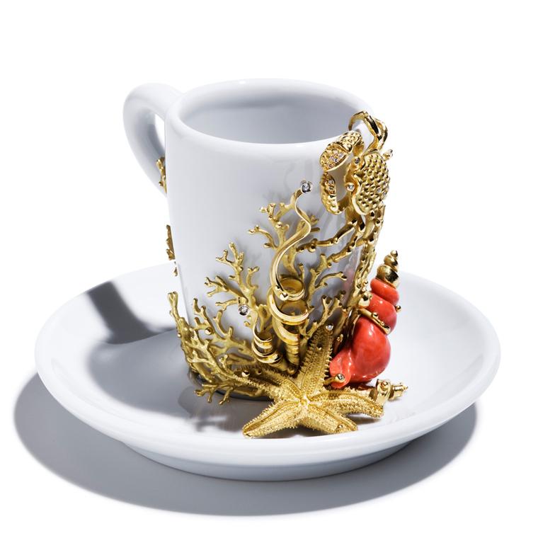 Massimo Izzo coffee cup featuring Mediterranean motifs in gold and coral, from the Jewels of the Sea collection.