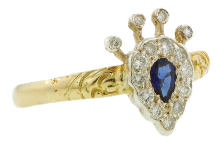 Crown/heart ring featuring a pear-shaped sapphire framed and topped with diamonds. From the private collection of Danielle Miele.