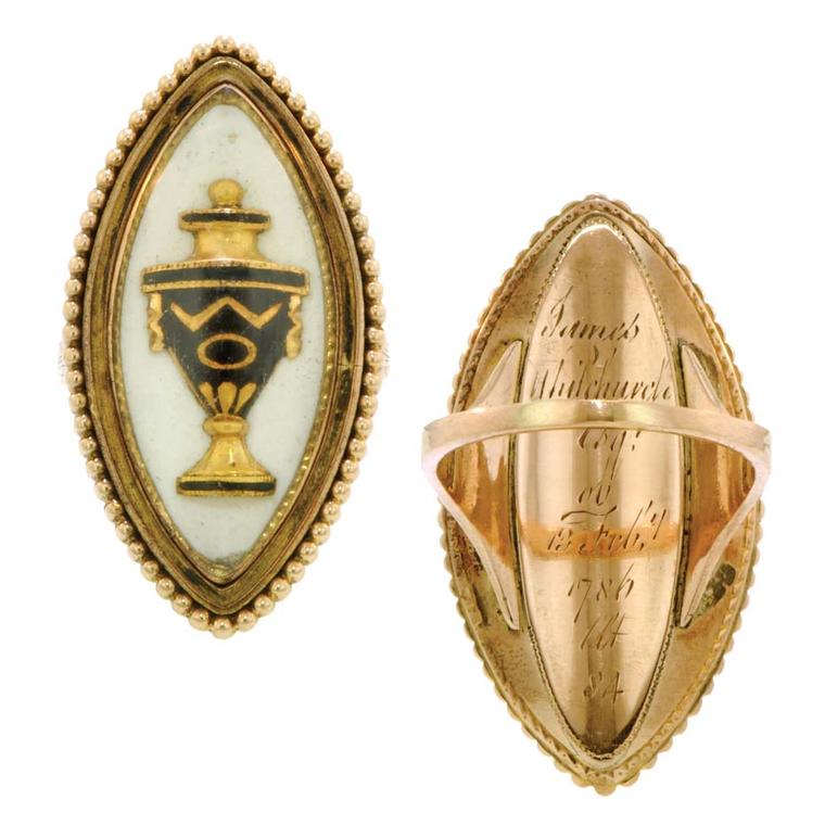 Mourning ring from 1786 featuring a black enameled urn under rock crystal in a navette-shaped frame with a beaded edge, engraved on the reverse Doyle & Doyle.