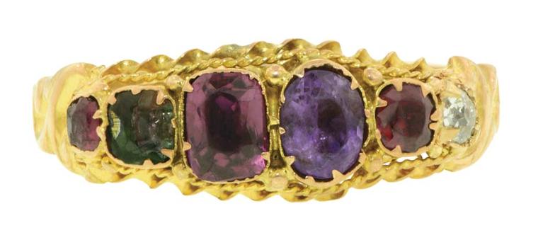 English Regard ring circa 1870 featuring ruby, emerald, garnet, amethyst and diamond stones in a twisted wire frame with scrolled shoulders.