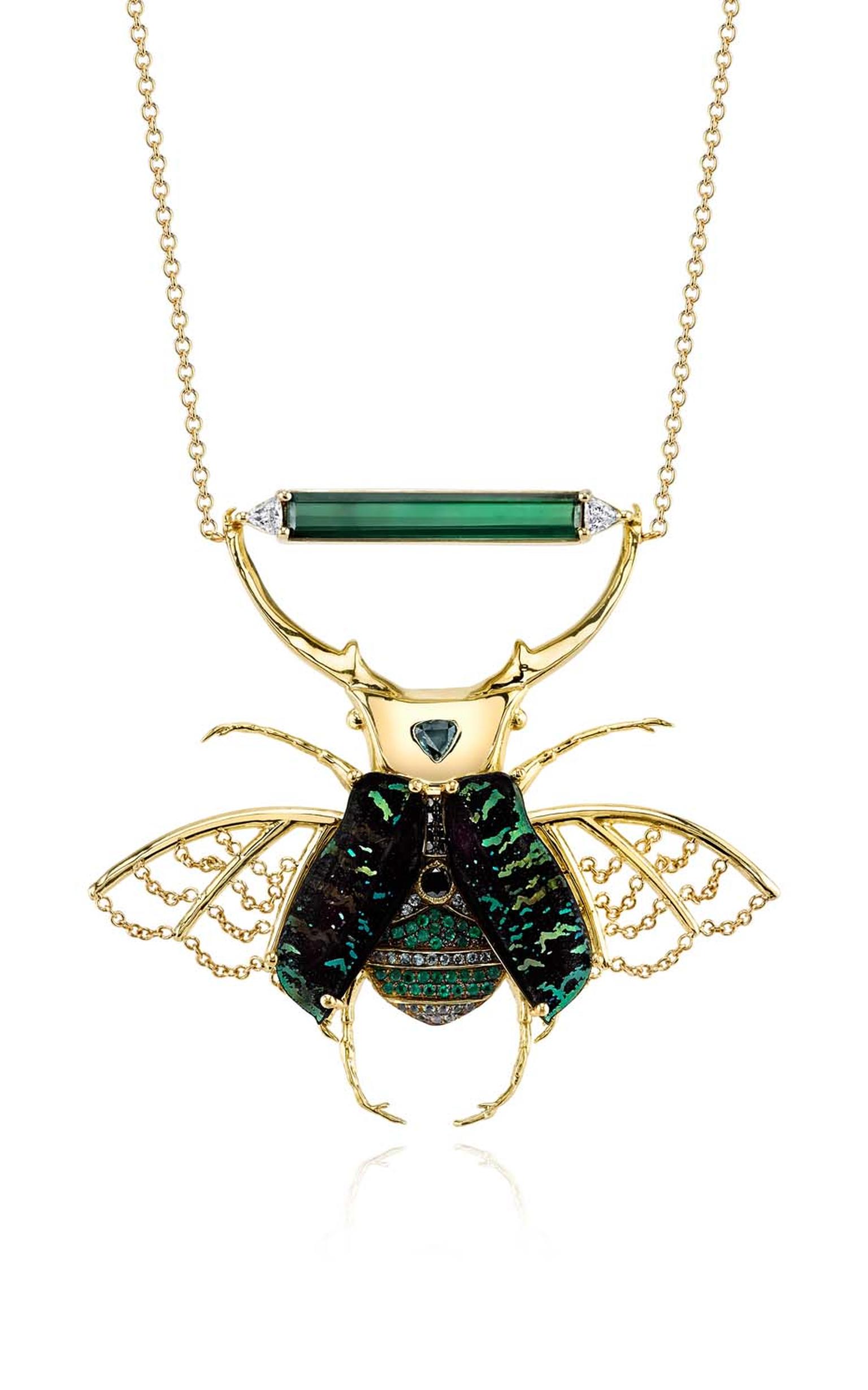 Daniela Villegas yellow gold Phoenix necklace with green tourmaline, black and white diamonds, green sapphires, emeralds and euchroea colestis elytras.