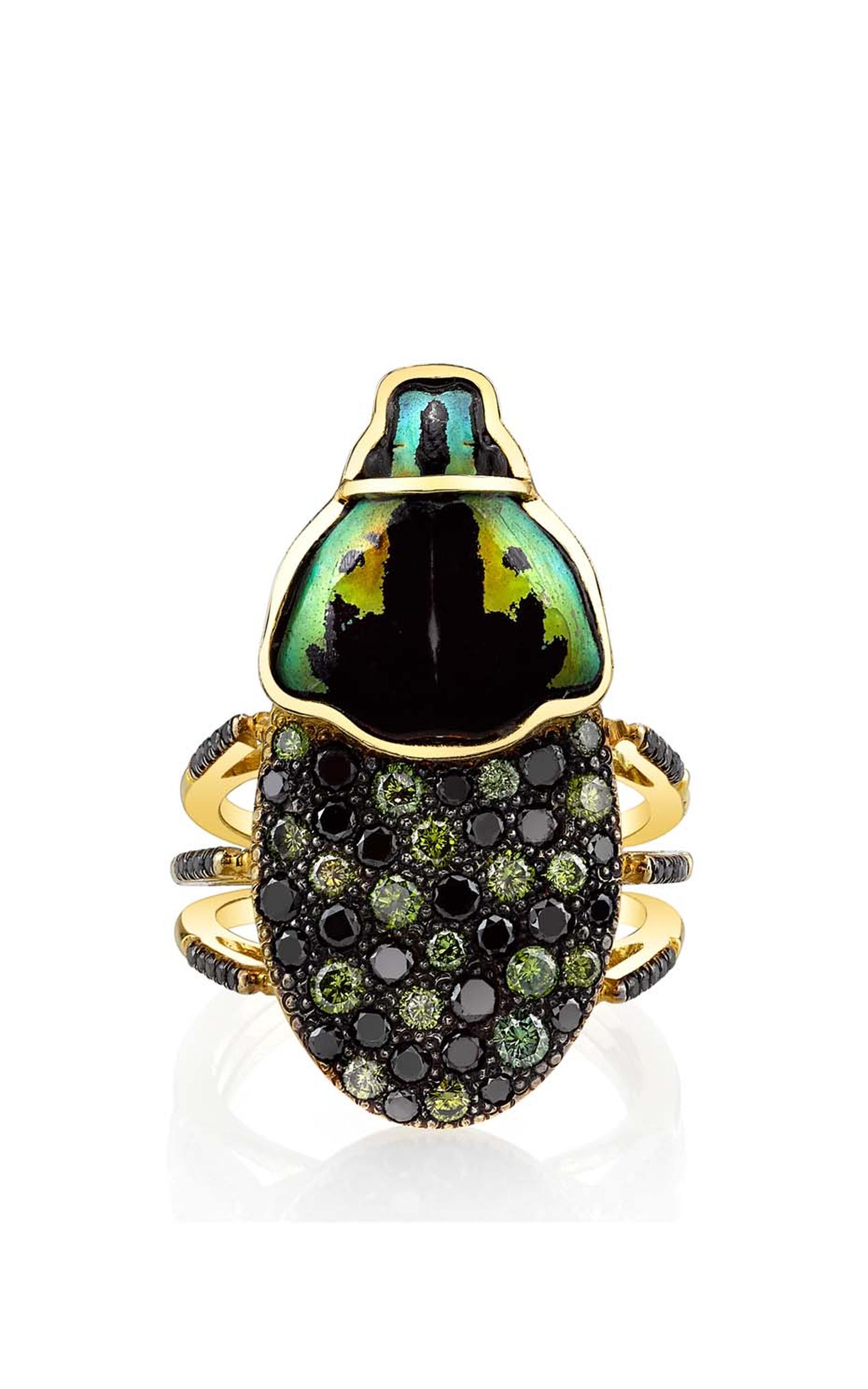Daniela Villegas yellow and black gold Sybarite ring with green and black diamonds.