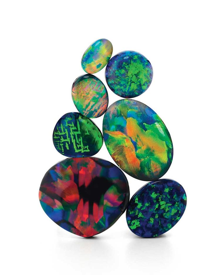 With black opals, the general rule is the darker the base and the colour bar sitting on top of it, the greater its worth per carat. Red hues are also highly prized. Photo courtesy: Giulians