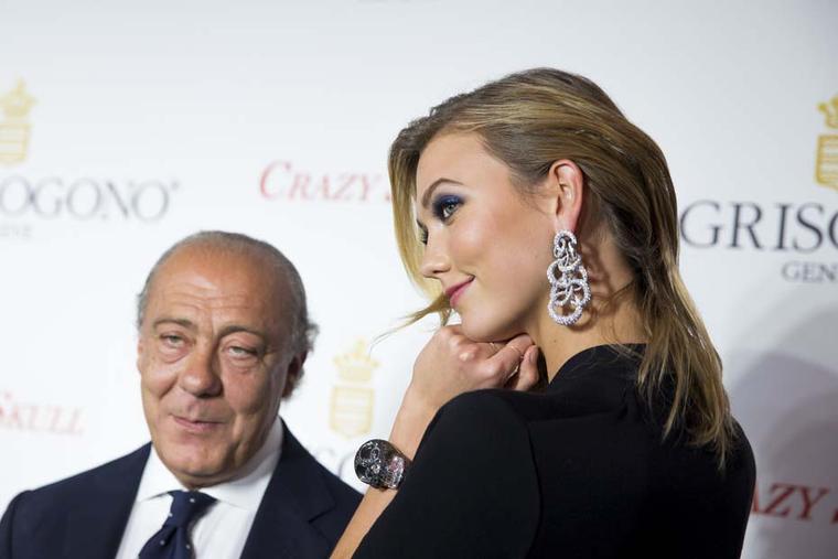 Fawaz Gruosi stands with Karlie Kloss who shows off the larger-than life Crazy Skull watch with black diamonds.