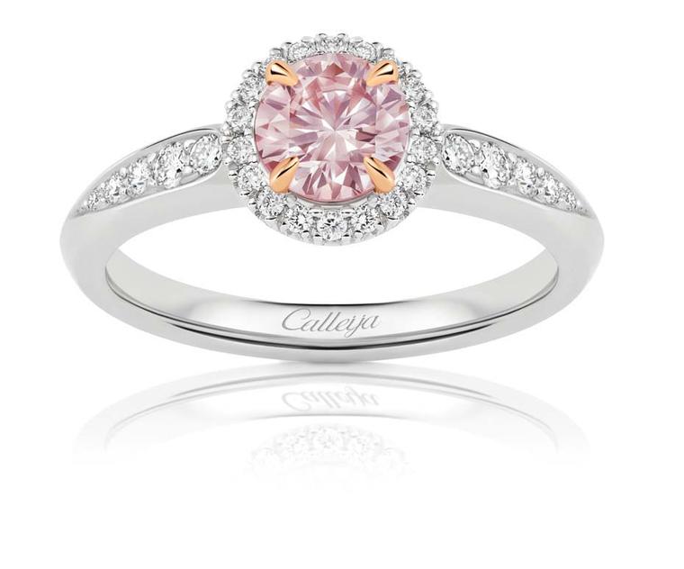 Calleija oval-cut pink diamond engagement ring featuring a pink diamond central stone surrounded by white diamonds.
