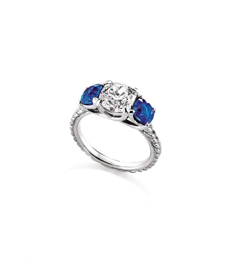 David Yurman diamond engagement ring featuring two sapphire side stones leading to the  band with the iconic Yurman Cable motif.