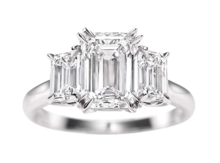 Harry Winston emerald-cut three stone diamond engagement ring.
