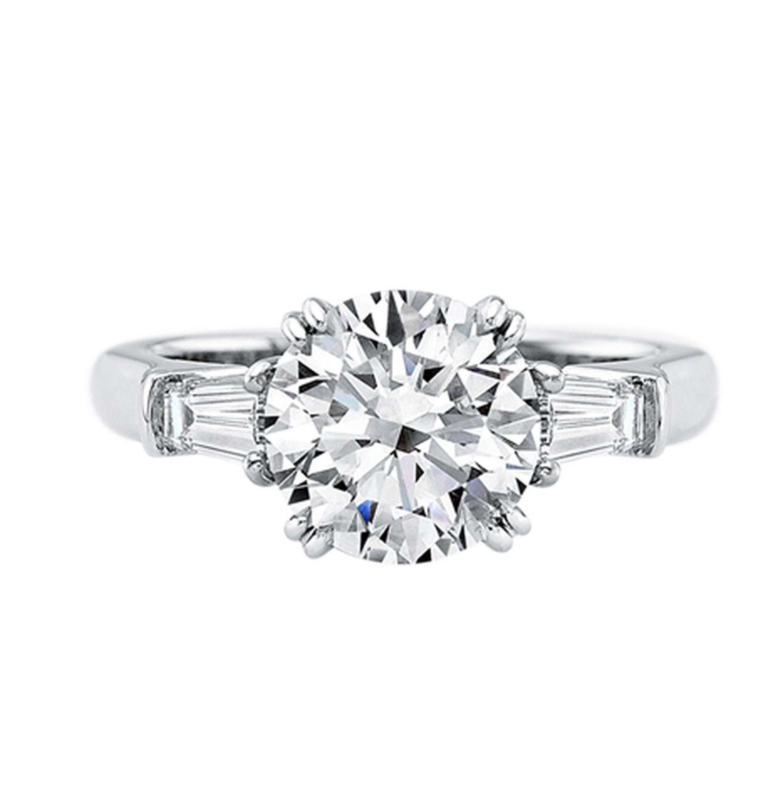 Harry Winston Classic Winston platinum diamond engagement ring featuring a 2.11ct round brilliant-cut diamond with tapered baguette side stones.