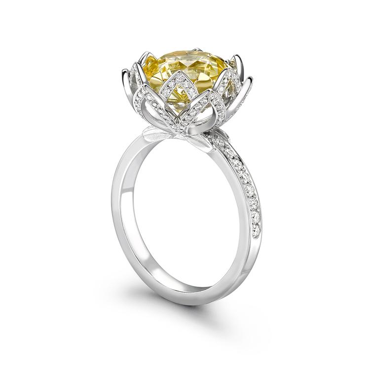 Theo Fennel Water Lily yellow sapphire engagement ring featuring a 5.88ct pale yellow sapphire enveloped in pavé diamond petals leading to the pavé band.