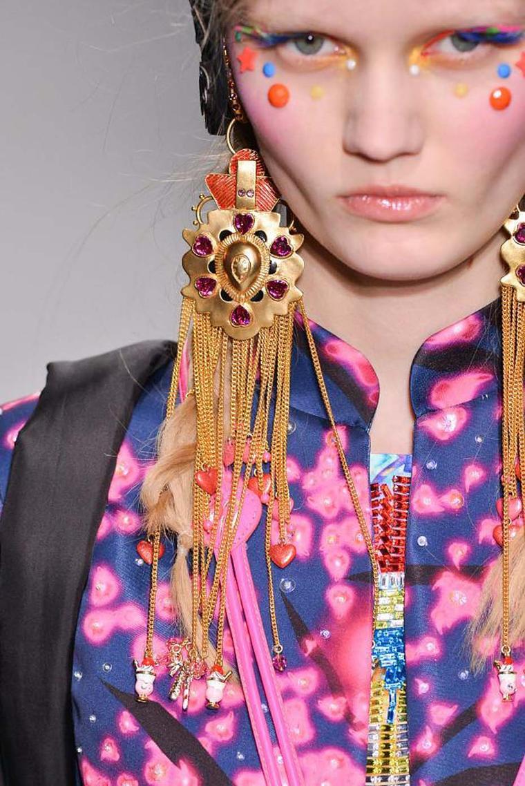 During Paris Fashion Week 2014, a model showcases earrings from the latest Amrapali and Manish Arora AW 14-15 collection.