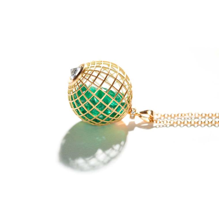 Roule & Co. yellow gold caged Globe pendant with emeralds.