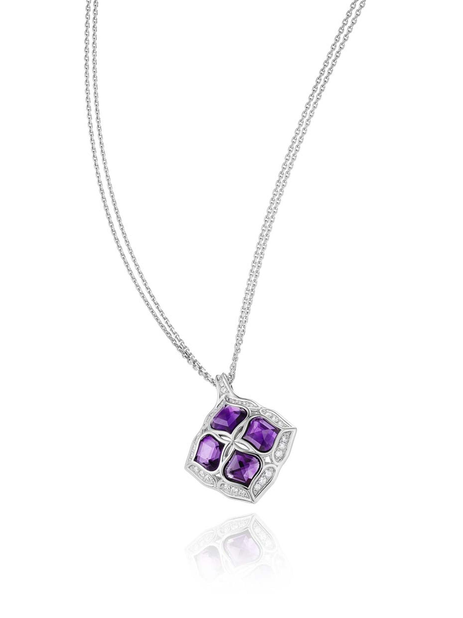 Chopard Imperiale pendant featuring a faceted amethyst surrounded by diamond-encrusted arabesque motifs.