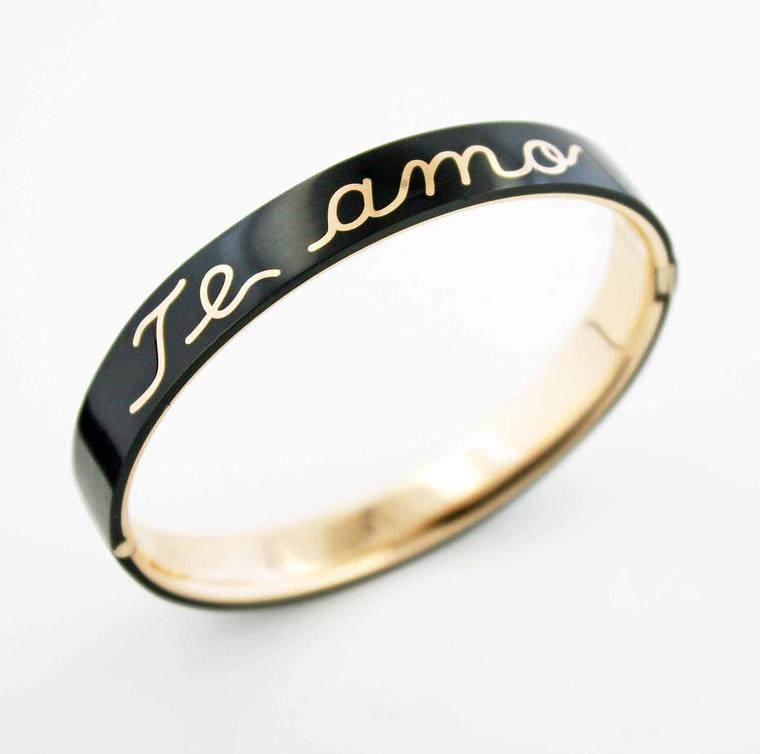 James de Givenchy Taffin black ceramic and gold Te amo bracelet.