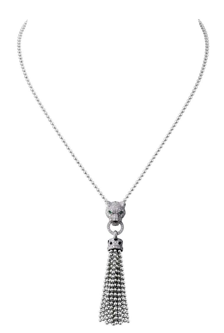 Panthe`re de Cartier necklace in white gold featuring a diamond panther with emerald eyes holding a tassel in its jaws.