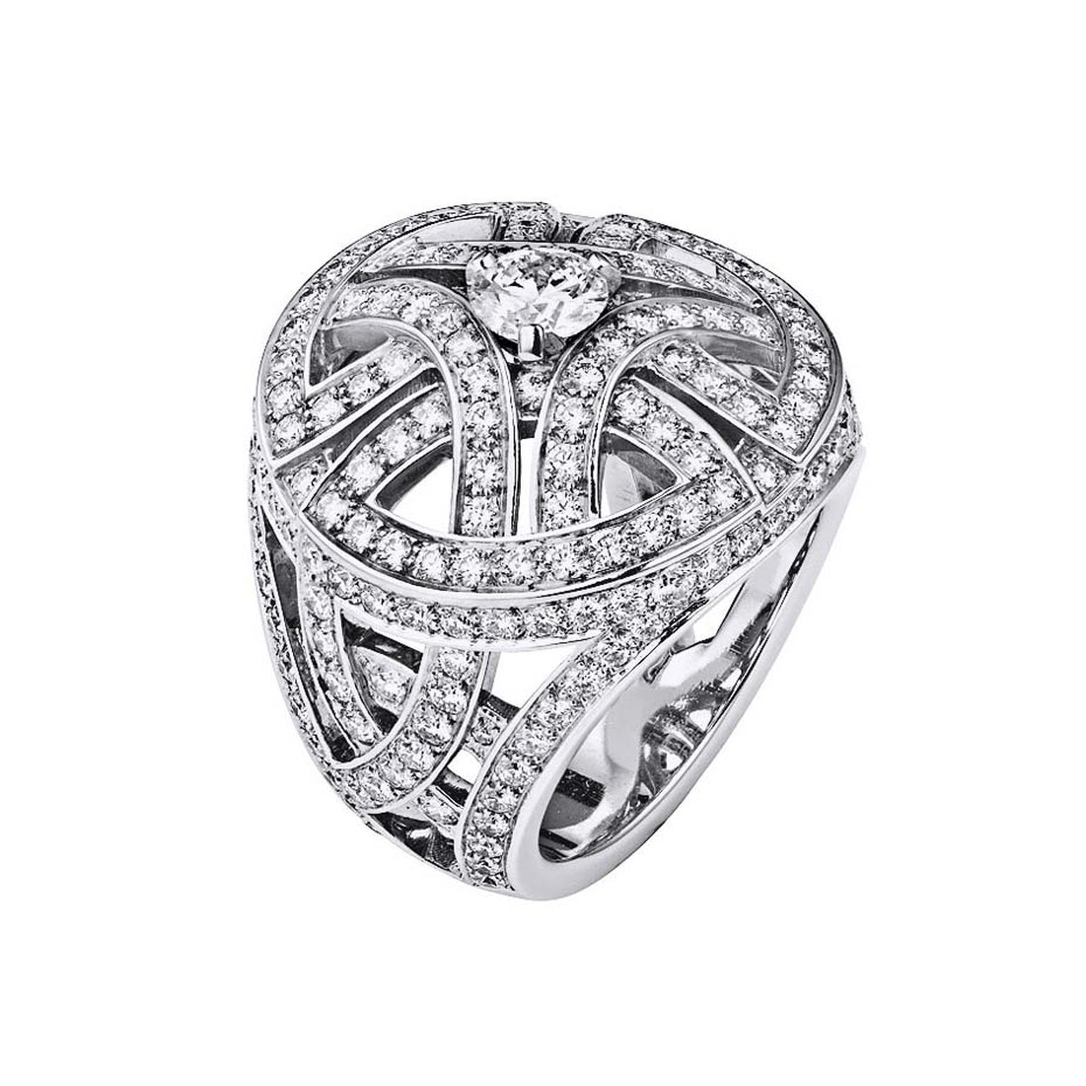 Cartier Paris Nouvelle Vague ring with arabesque motifs pavéd entirely with diamonds and set with a dazzling brilliant-cut diamond in the centre.