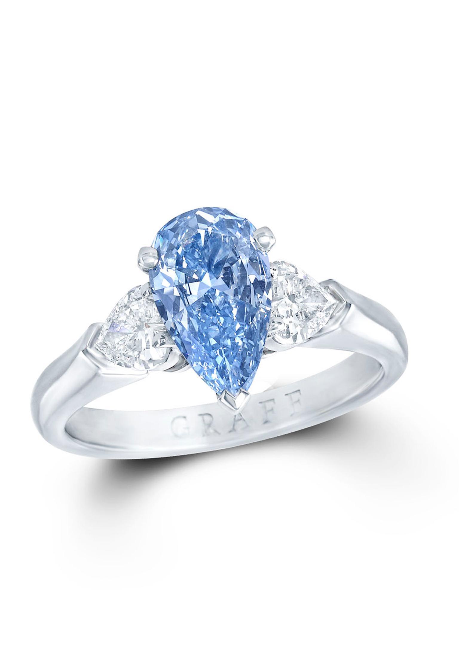 Graff 1.04ct Blue Internally Flawless diamond ring flanked by two pear-shaped white diamonds.