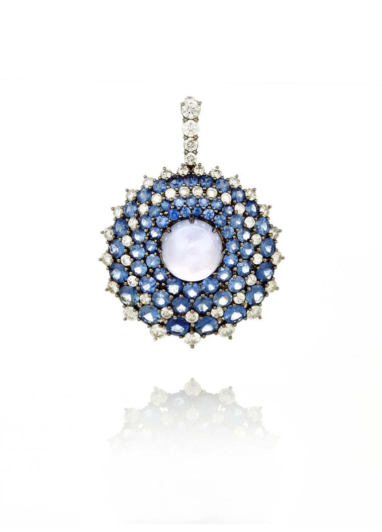 Nam Cho Riviera convertible pendant and pin with a central pastel blue chalcedony orb surrounded by circles of random pavé-set faceted sapphires and diamonds (from $26,500).