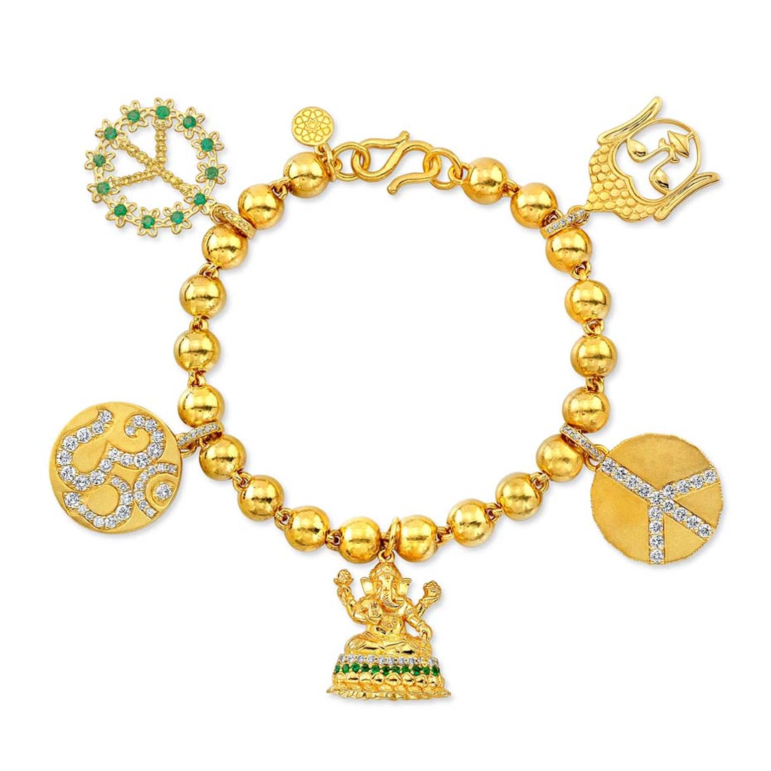 Buddha Mama Auspicious charm bracelet in gold with diamonds and emeralds ($19,000).