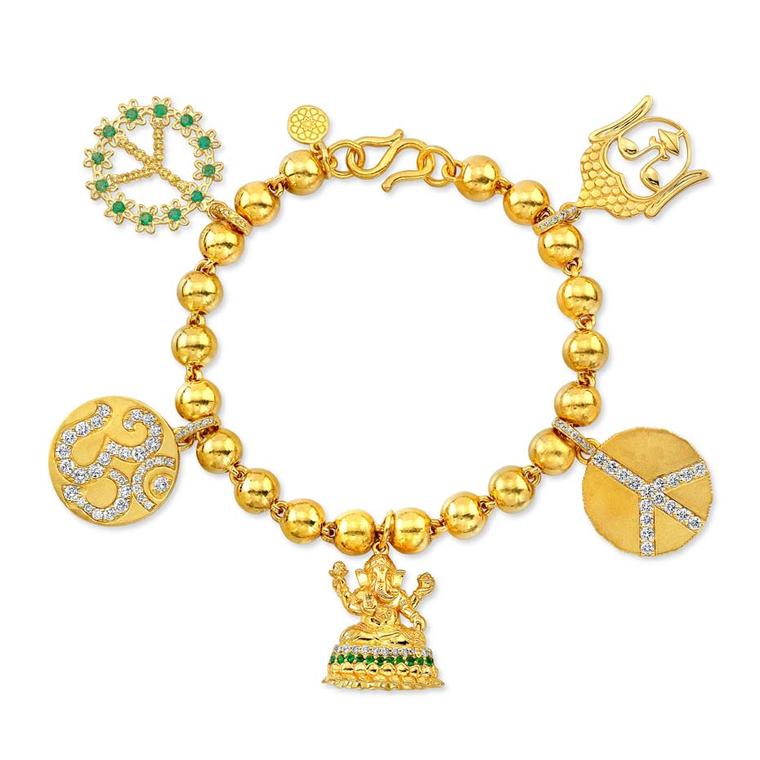 Buddha Mama Auspicious charm bracelet in gold with diamonds and emeralds ($19,000).
