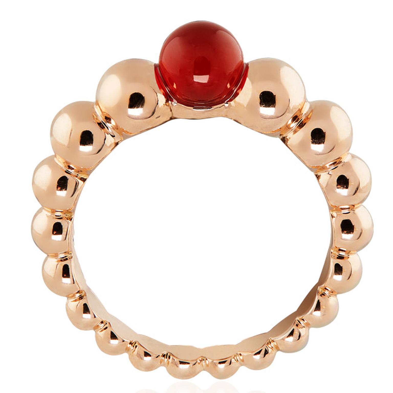 Van Cleef & Arpels Perlée Couleurs rose gold ring, set with a vivid red cornelian gemstone at the crown (£1,550).