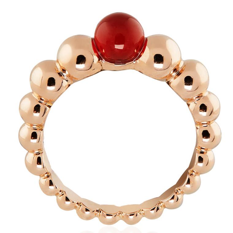 Van Cleef & Arpels Perlée Couleurs rose gold ring, set with a vivid red cornelian gemstone at the crown (£1,550).