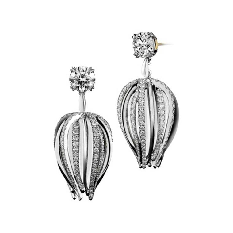 Alexandra Mor curved dangling diamond earrings set in white and black gold.