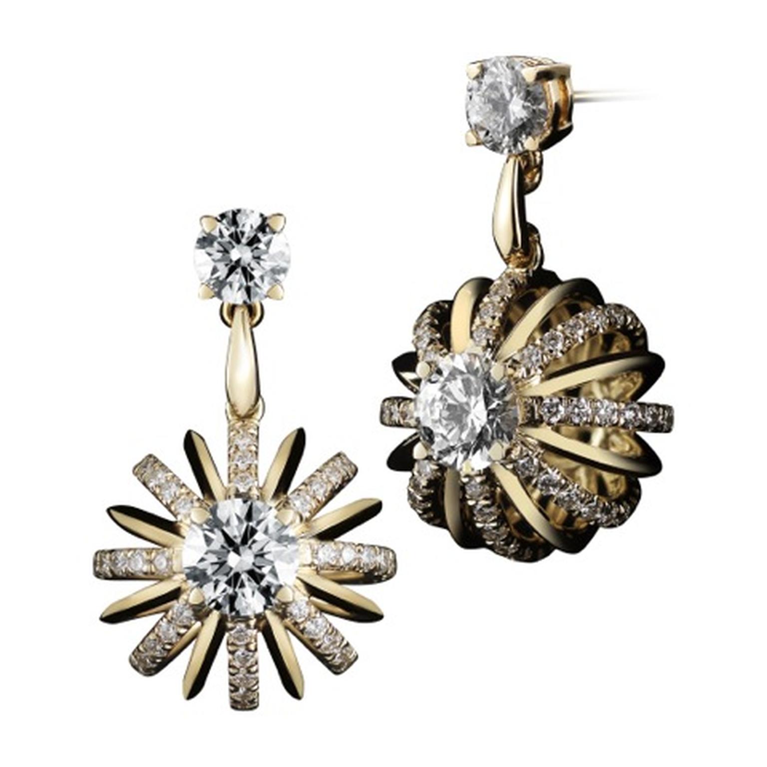 Alexandra Mor yellow gold Dangling Snowflake earrings with diamonds.