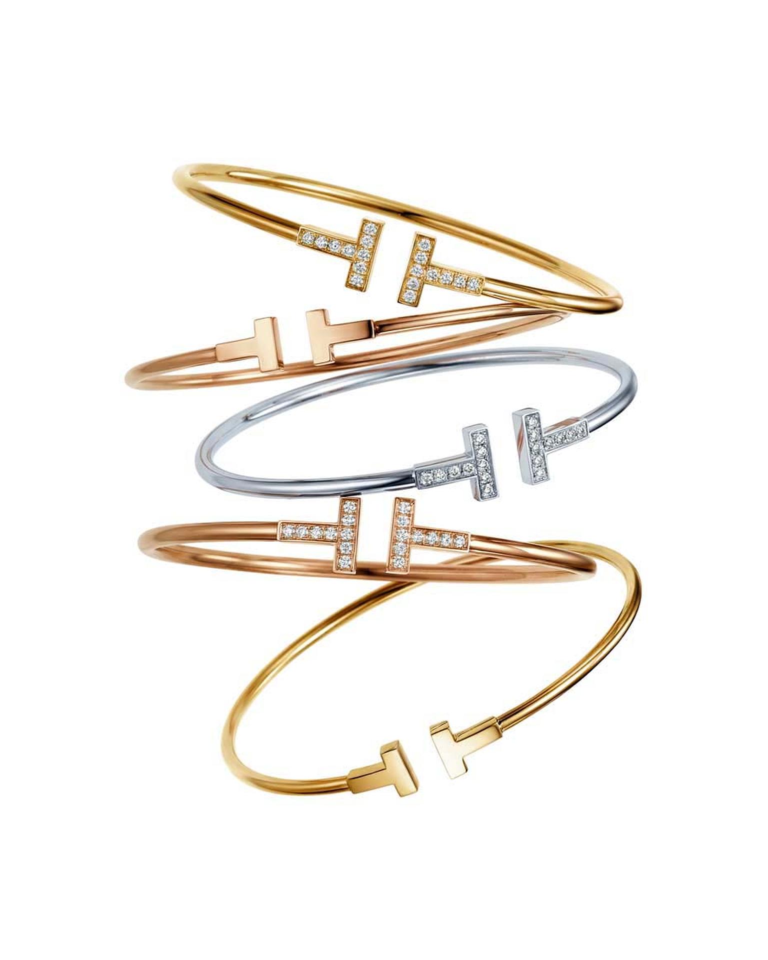Two graphic diamond-studded T's accentuate the simple lines of the Tiffany & Co. Tiffany T collection wire bracelets, available in white, yellow and rose gold, with or without diamonds.