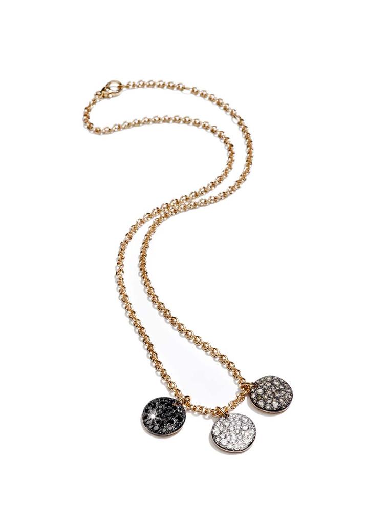 Pomellato Sabbia pendant with three rose gold discs set with black, white and brown diamonds.